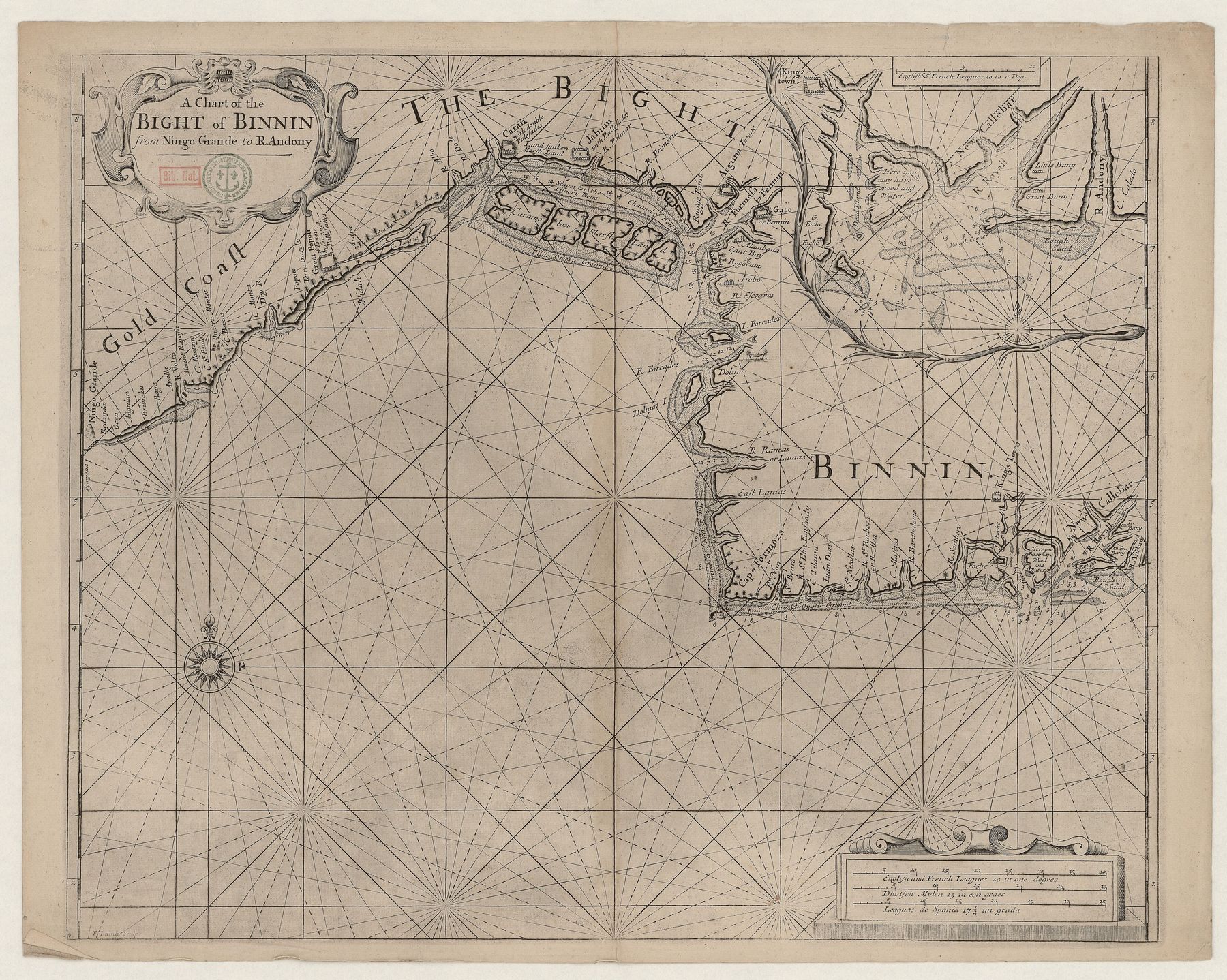 An antique sea chart on yellowed paper: a coastline runs across the upper half with dense place names, and rhumb lines radiate across the empty sea below.